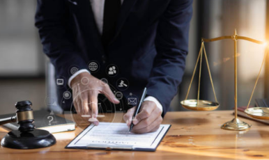 A professional lawyer signs a contract, solidifying legal commitments with a client